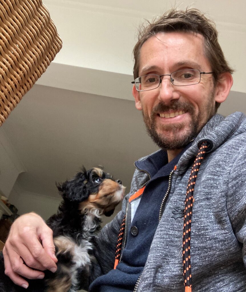 Enzo sitting on Jonathan's lap.